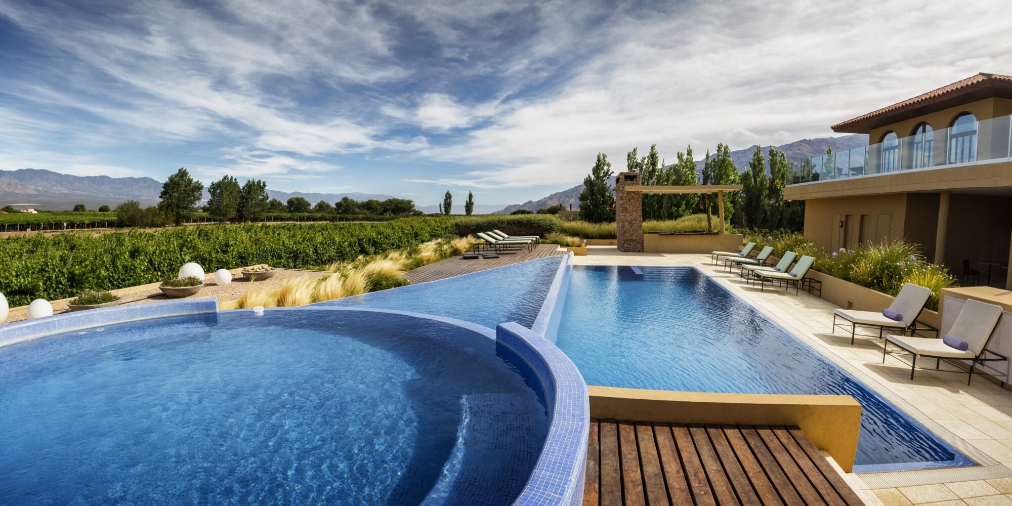 A picture of the Grace Cafataye Hotel's pool in Argentina. A luxurious scene at the Grace Cafayate Hotel in Argentina.