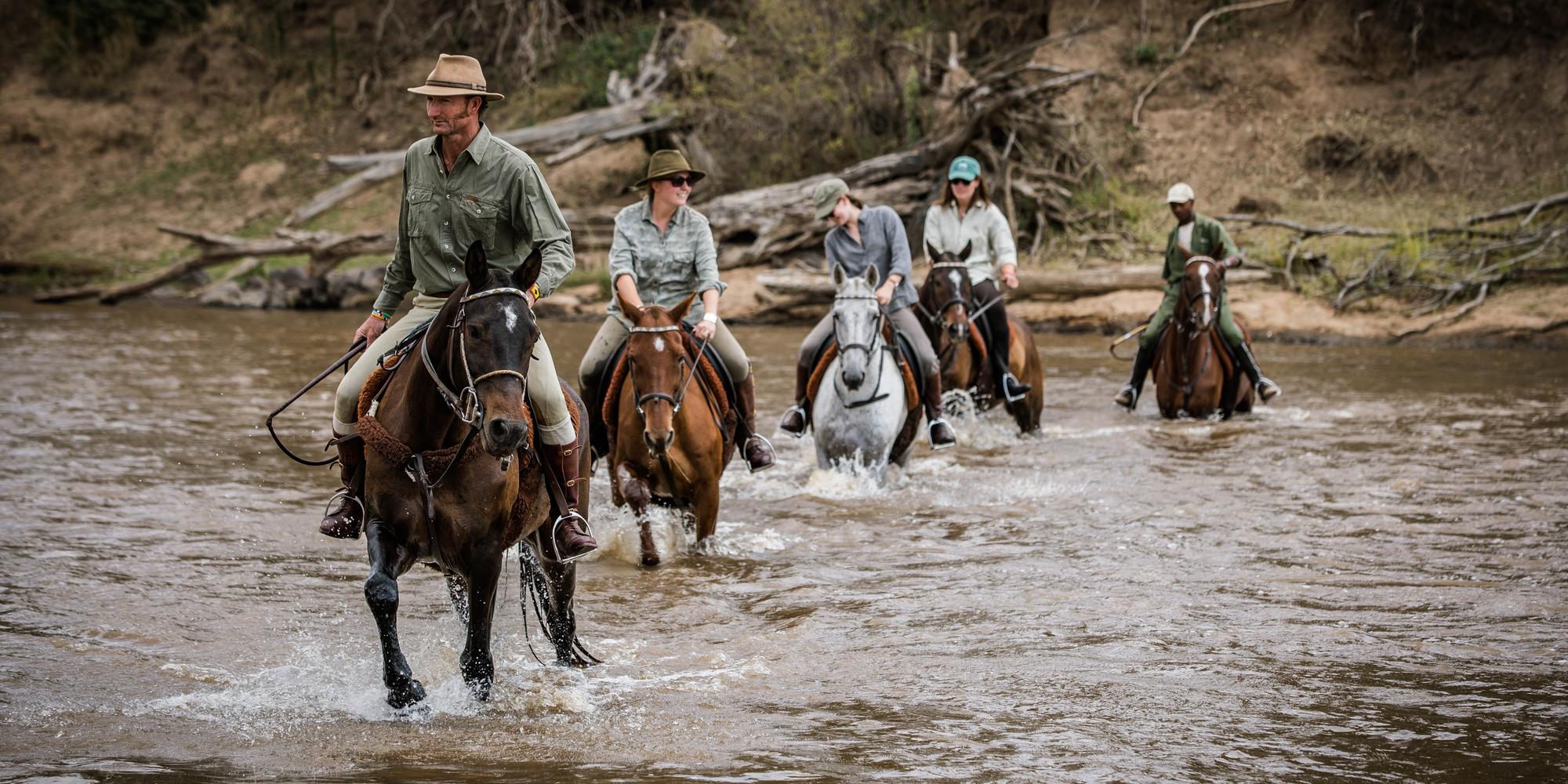 Guests on horseback riding in the Masai Mara. Masai Mara on Horseback Safari.