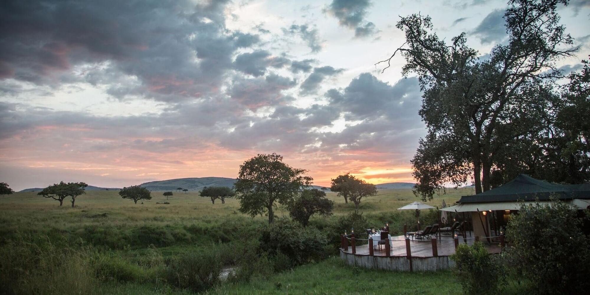 A sunset view of the Sky Safari in Kenya. A sunset view of Sky Safari with acacia trees and mountains.
