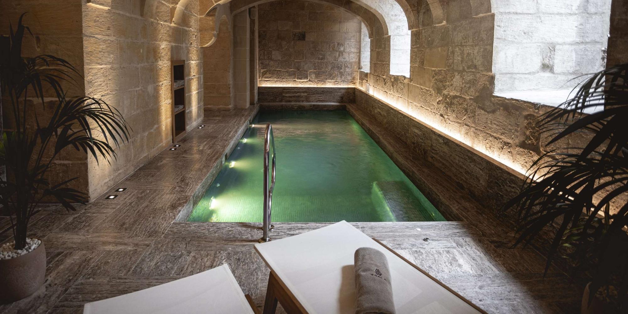 An image of a indoor pool or spa area built into a stone or concrete structure at Iniala Harbour House in Malta. Indoor swimming pool or spa area at the Iniala Harbour House in Malta.