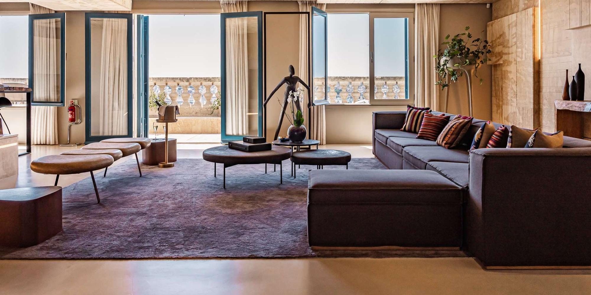 An image of a luxury living room of Iniala Harbour House in Malta. A luxury living room interior of Iniala Harbour House in Malta.