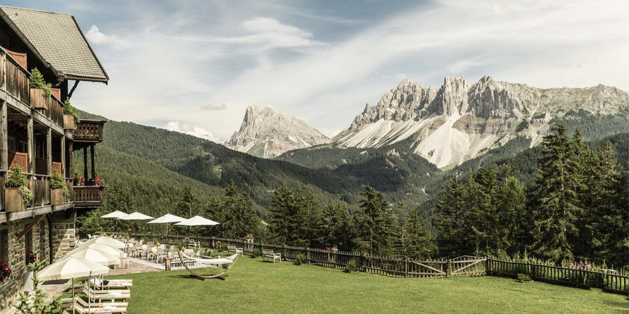 A picture of Forest Dolomites, a luxury five-star mountain resorted located in Italy. A resort situated in a alpine landscape Forestis Dolomites in Italy