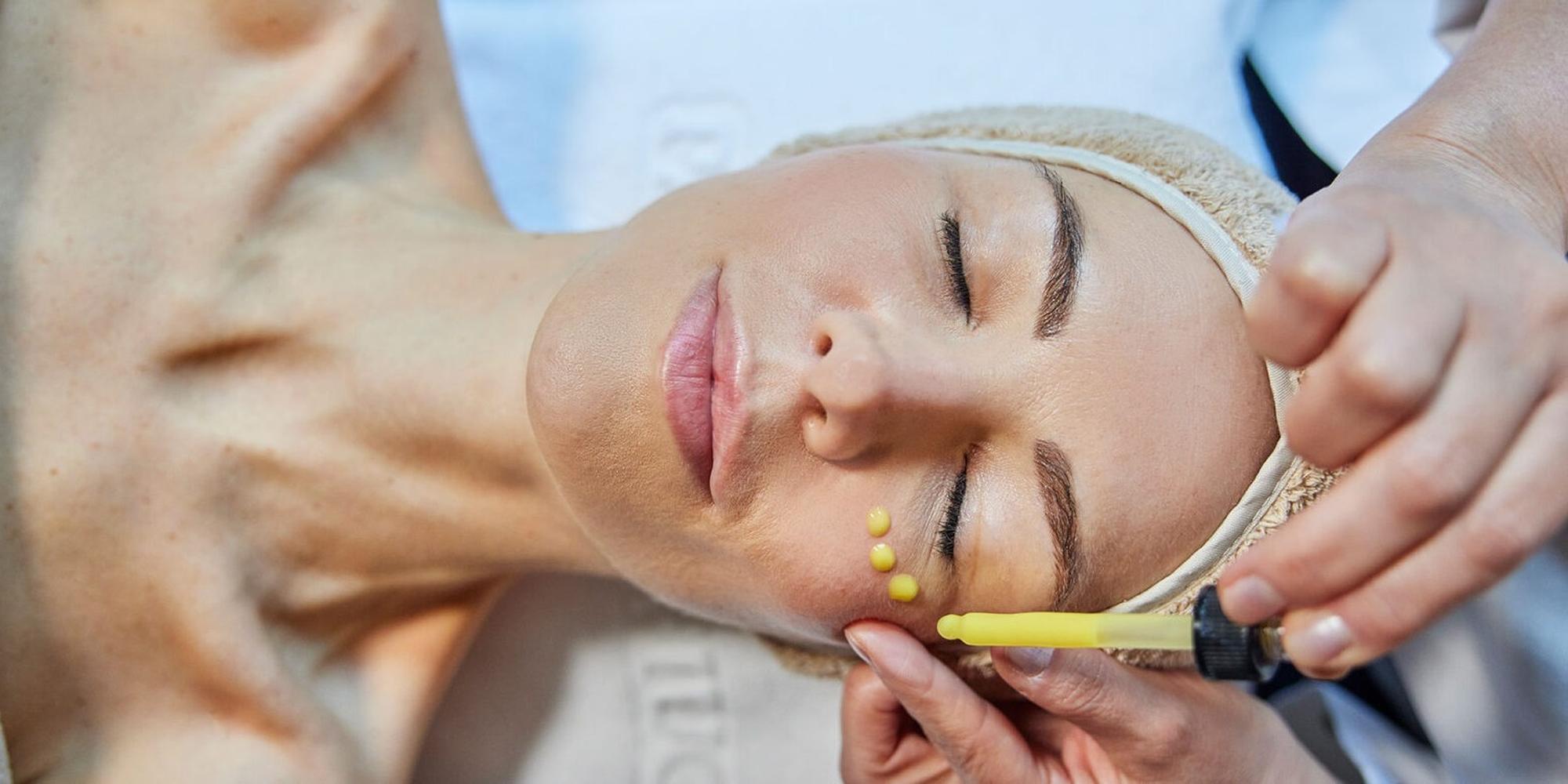 An image of a woman receiving a professional skin treatment at Palazzo Fiuggi in Italy. . A person receiving a professional skin treatment at Palazzo Fiuggi.