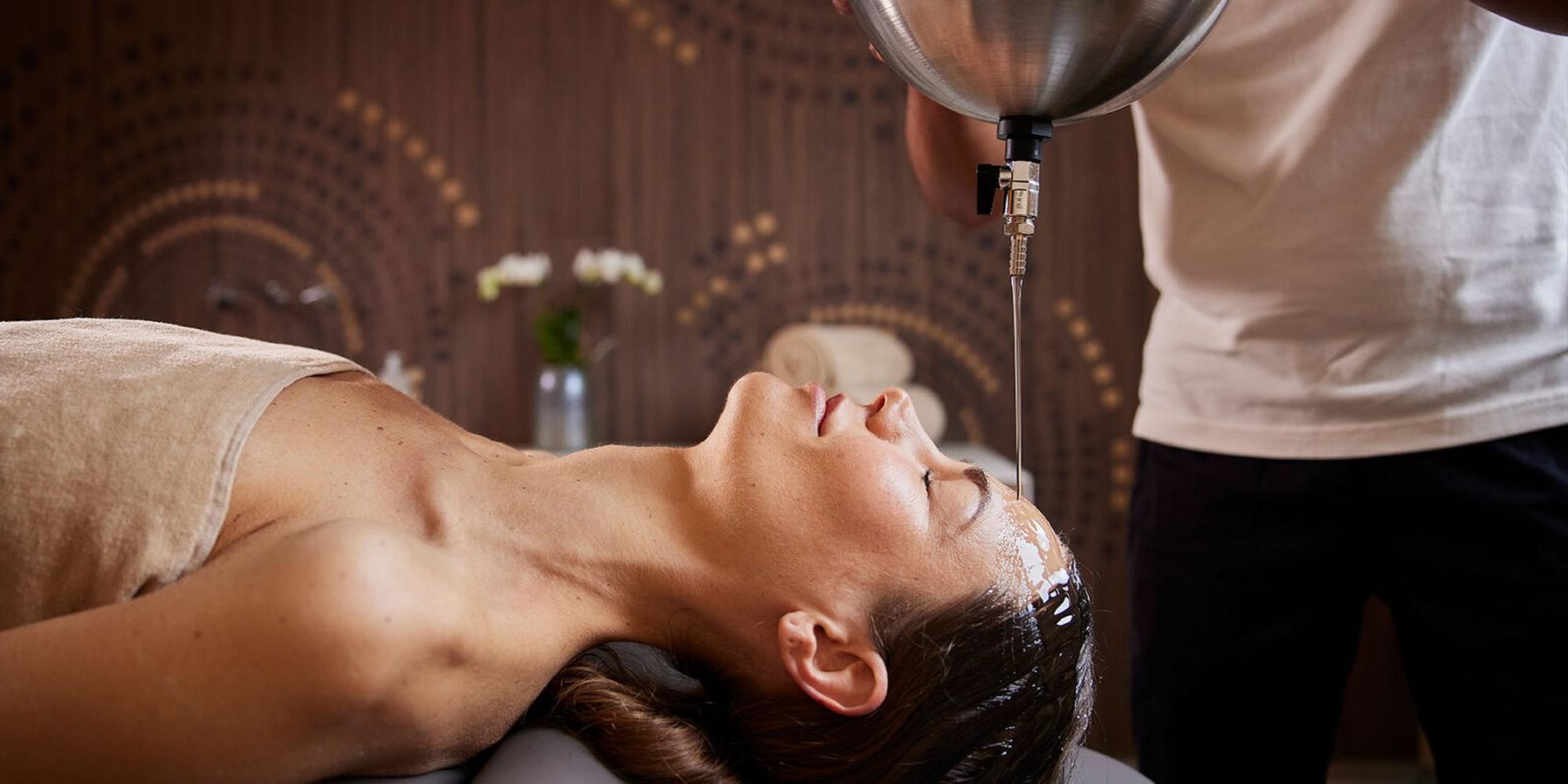 A picture of a woman receiving a spa treatment at Palazzo Fiuggi in Italy. A luxurious spa experience at a wellness retreat at Palazzo Fiuggi in Italy.
