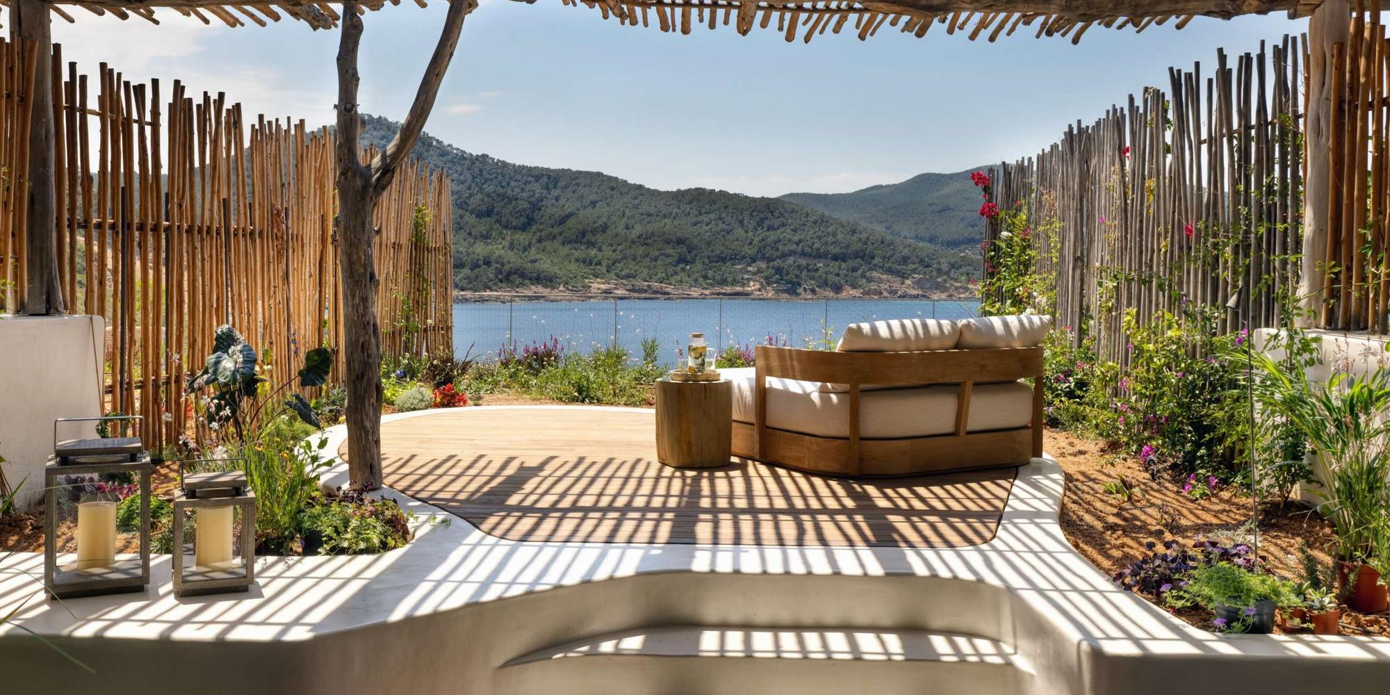 A terrace view overlooks Xarraca Bay at the Six Senses Ibiza resort in Europe.
