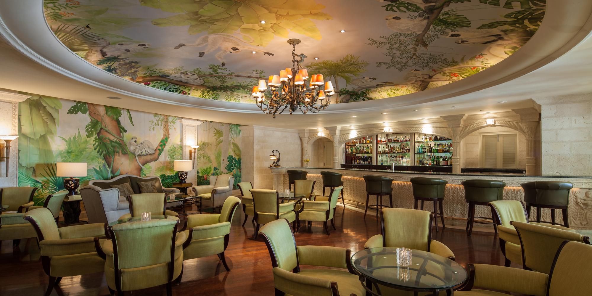 Monkey Bar restaurant and bar features a large ornate chandelier at Sandy Lane Hotel in Barbados. Monkey Bar restaurant and bar features a large ornate chandelier at Sandy Lane Hotel in Barbados.