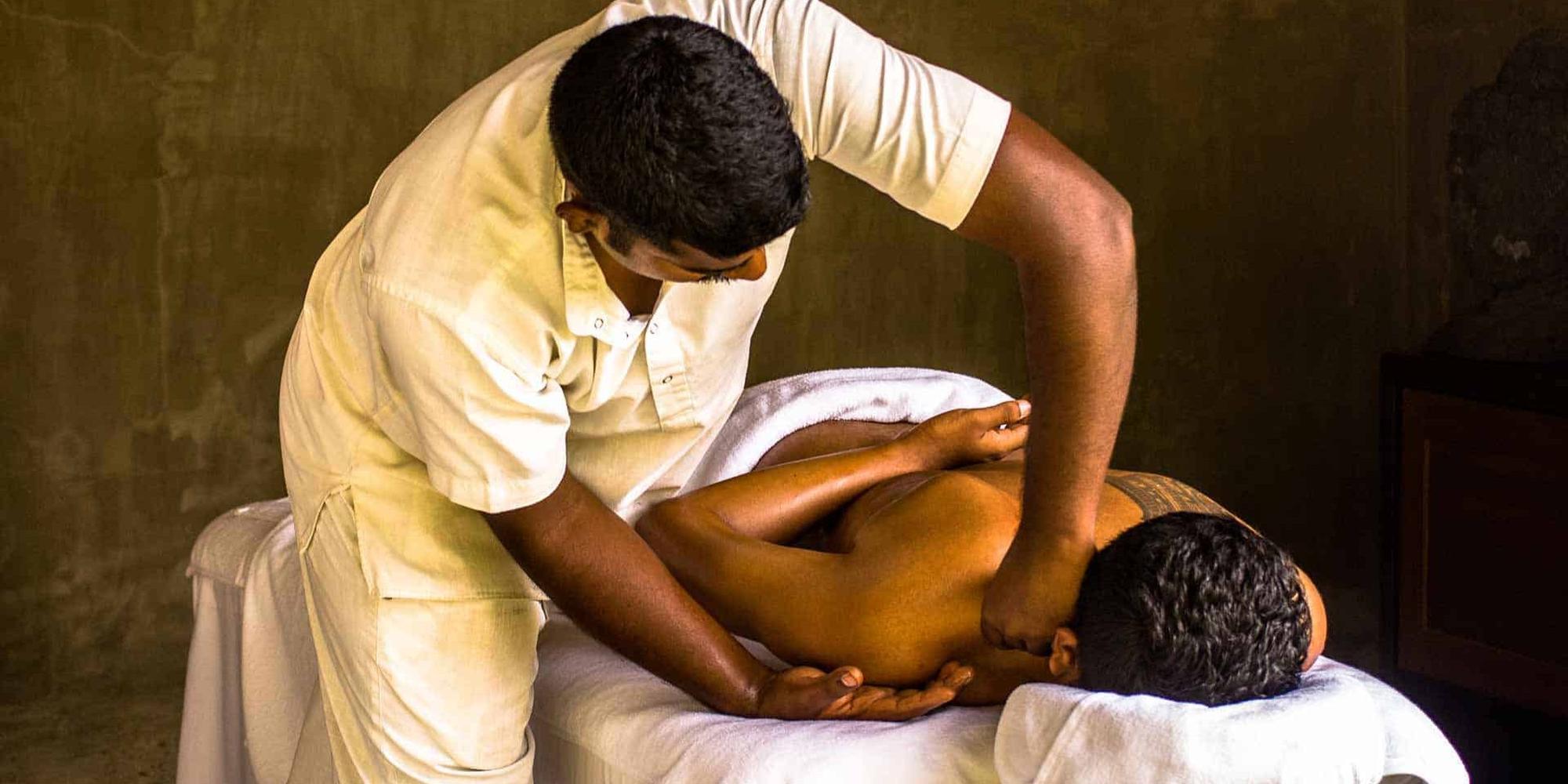 A person receiving a therapeutic massage treatment at Santani Wellness in Asia. 