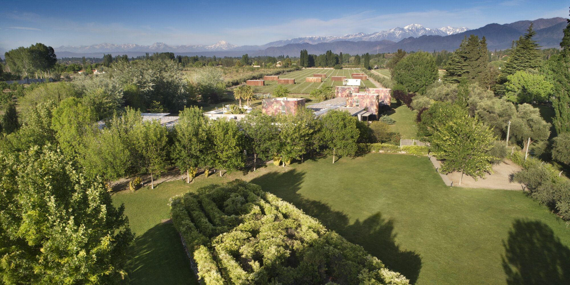 An image depicts the expansive landscaped gardens at Llao Llao Hotel & Resort, Argentina. An image depicts the expansive landscaped gardens at Llao Llao Hotel & Resort, Argentina.